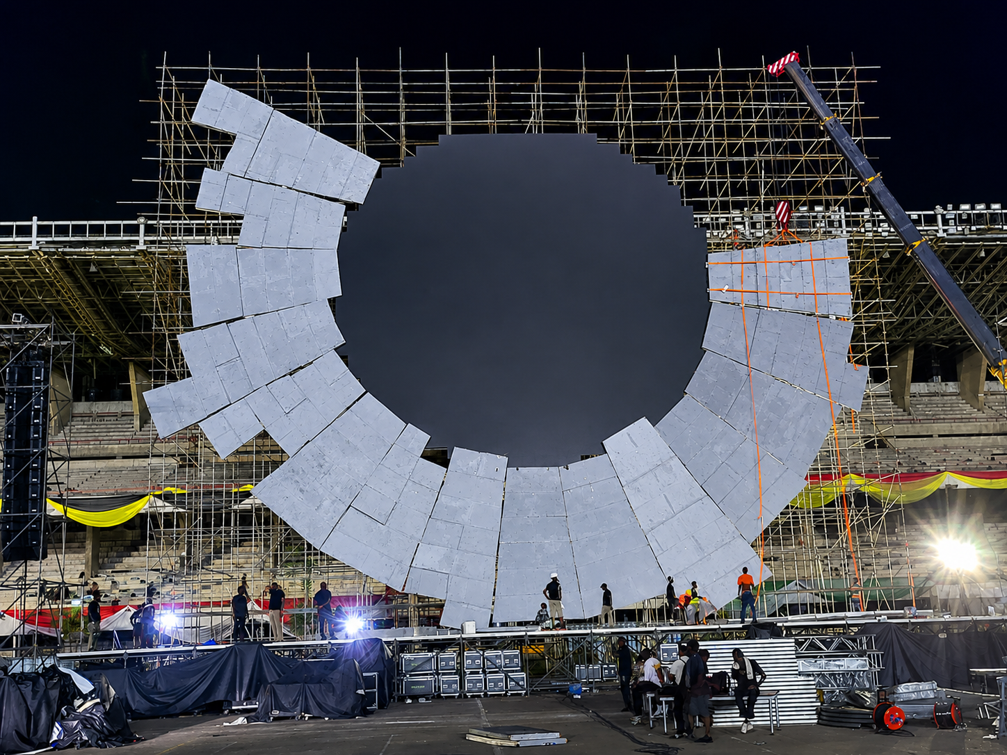 Circular Wizkid GOAT stage surround being assembled on scaffolding